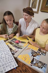 Mother and daughters scrapbooking